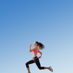 Obraz na płótnie Canvas Composite image of full length of healthy woman jogging 