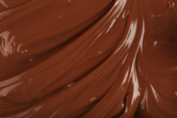 Background of melted milk chocolate, close-up