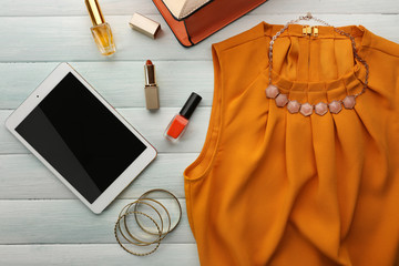 Bright fashion look on wooden background, close up