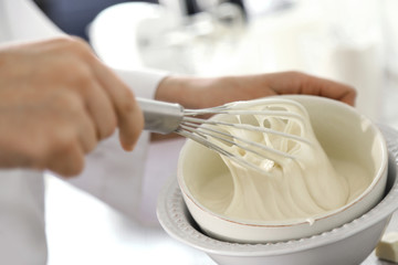 Cooking buttery cream on kitchen