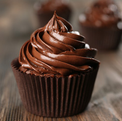 Chocolate cupcakes on dark wooden background
