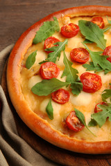 Pizza Margherita with arugula and vegetables, close-up