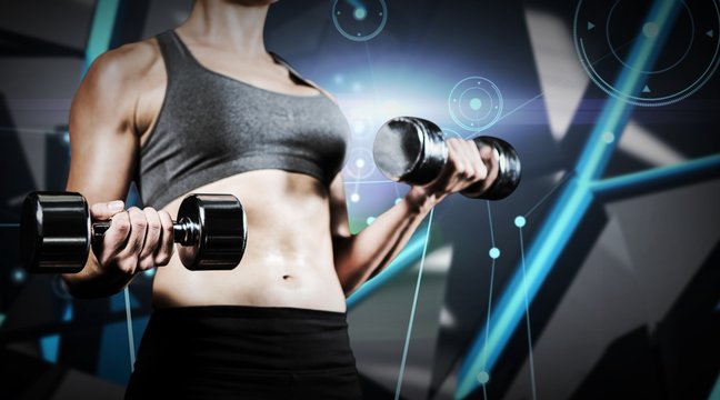 Composite image of muscular woman lifting heavy dumbbells