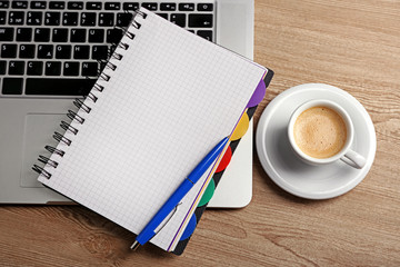 Empty  notebook on laptop keyboard, on light background