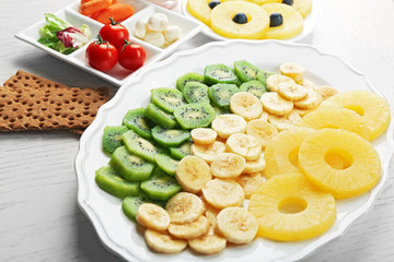Fruits and vegetables on light wooden background. healthy eating concept.
