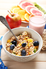 Tasty oatmeal and fruits on wooden background. Healthy eating concept.