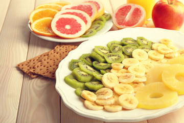 Fruits on wooden background. Healthy eating concept.