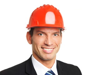 Handsome businessman in a protective helmet, right you can write some text