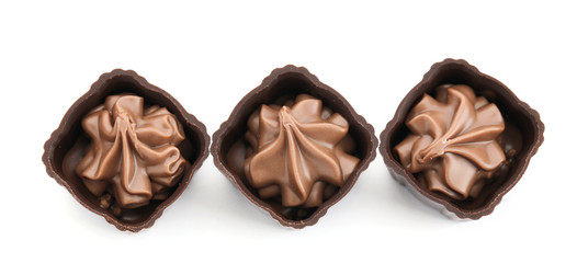 Three chocolate praline candies, isolated on white