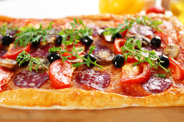 Rectangle delicious pizza on the table, close-up