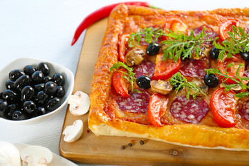 Rectangle delicious pizza on the table, close-up
