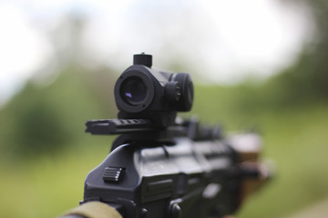 Man aiming at a target and shooting an automatic 