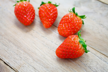 Fresh strawberries on wooden background