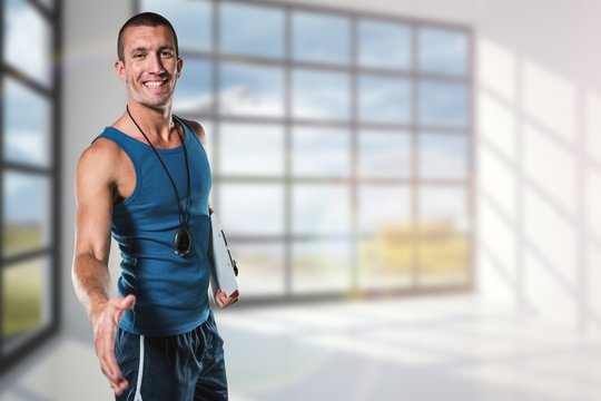 Composite image of happy personal trainer giving handshake
