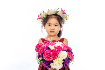 Beautiful little girl in red dress with flowers isolated on white background