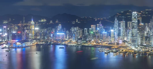 Tuinposter Aerial view of Hong Kong City at night © leeyiutung