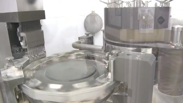 Tilting shot of circular metal turntable.