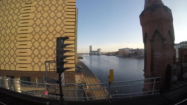 berlin skyline - crossing oberbaum bridge / river spree, slow motion