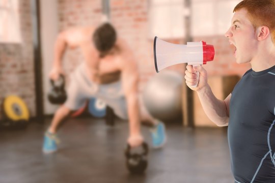 Angry rugby player yelling through the megaphone