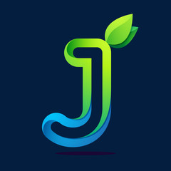 J letter with green leaves and water waves.