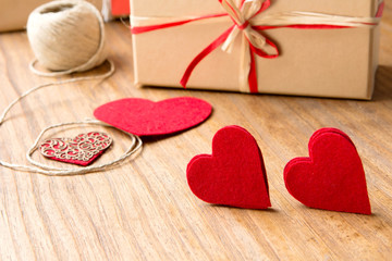 Gifts for Valentine's Day. Decorative boxes and felt hearts