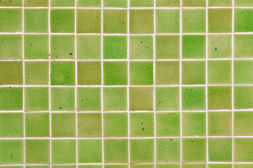 Green ceramic tile wall background.