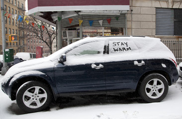 Automobile with snow and message