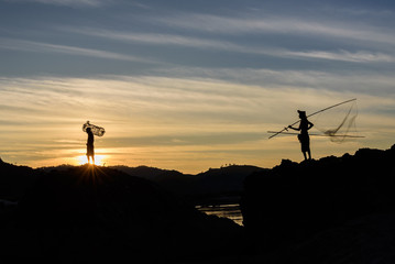 silhouette fishermen