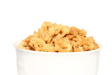 pork crackling in white bowl on isolated background