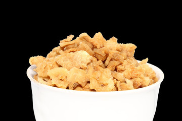 pork crackling in white bowl on isolated background