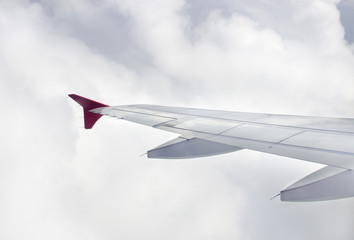 Wing of an airplane in cloudy, View of jet plane wing