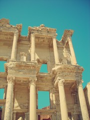 Archaeological remains of the old library at Ephesus, Anatolia, Turkey, on a sunny day. Image filtered in faded, retro, Instagram style with soft focus; nostalgic vintage travel concept.