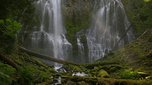 Slow motion (96 fps), locked down view of Proxy Falls with a God ray strengthening and weakening, near Sisters in Central Oregon.