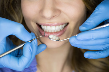 Dentist examining a patient's teeth in the dentist.