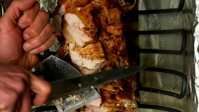 Cutting meat being before make a shawarma or doner kebab
