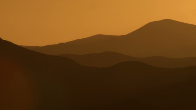 Royalty Free Stock Video Footage of silhouetted mountains at sunset shot in Israel at 4k with Red.