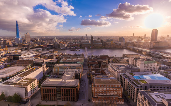 Panoramic skyline view of south London from the top of St.Paul's Cathedral at sunset with blue sky and clouds and River Thames - London, UK
