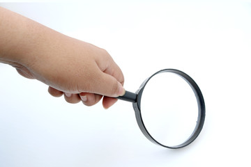 Magnifier in hand  on white background