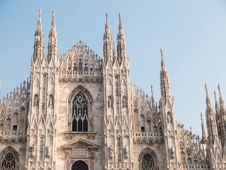 Fototapeta na wymiar Italian Gothic Facade of Historic Milan Cathedral