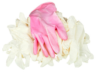 one used pink glove on pile of new medical gloves