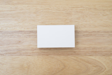 blank business cards stack up on wooden table