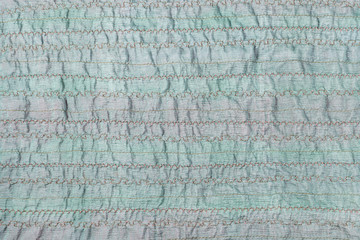 stitched green fabric