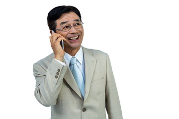 Smiling asian businessman phone calling