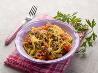 tagliatelle with sausage and fresh tomatoes