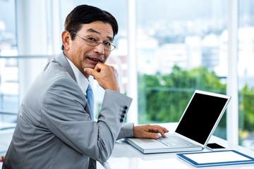 Fototapeta premium Portrait of businessman working 