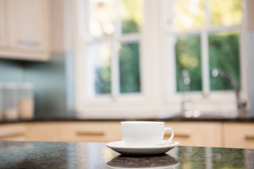 Fototapeta na wymiar White cup on kitchen counter
