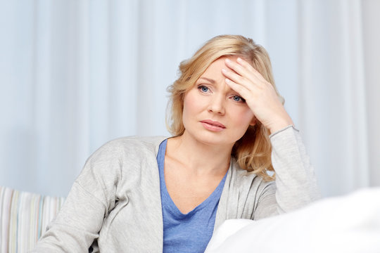 woman suffering from headache at home