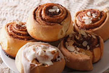 cinnamon rolls with icing close-up on a plate. horizontal
