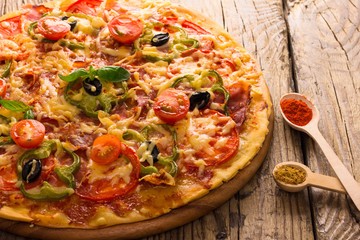 pizza served on wooden table