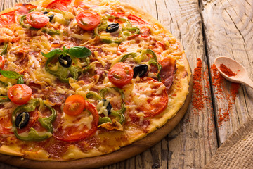 pizza served on wooden table